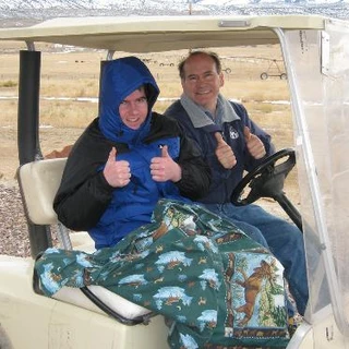 Alex and Dad on a golf cart