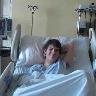 Alex in his hospital bed