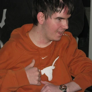 Alex giving a thumbs up in his Texas room