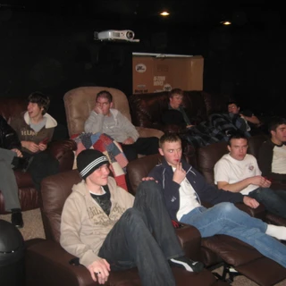 Alex with the young men in the theater room