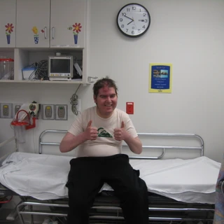 Alex smiling at the hospital