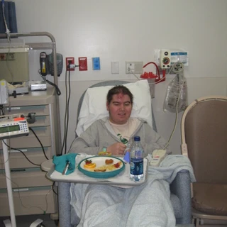 Alex eating in his hospital bed