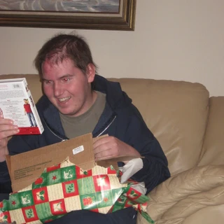 Alex opening a Christmas present