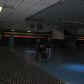 Alex at rollerblading with Nicole and Dad