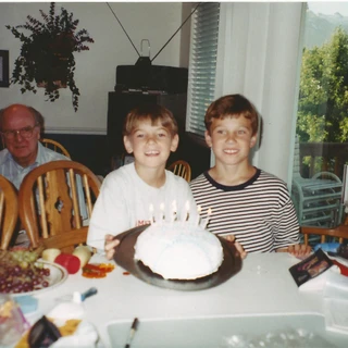 Alex and Chris with a birthday cake