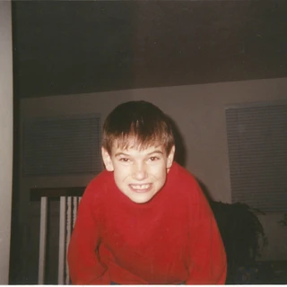 Alex wearing a red shirt