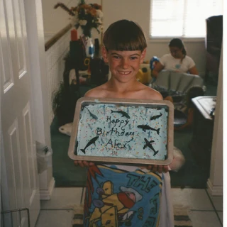 Alex holding an ocean birthday cake