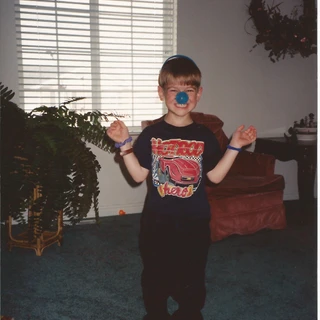 Alex wearing a blue nose