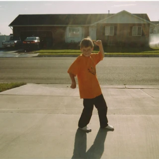 Alex flexing in the driveway