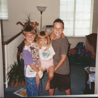 Alex and Chris holding Nicole