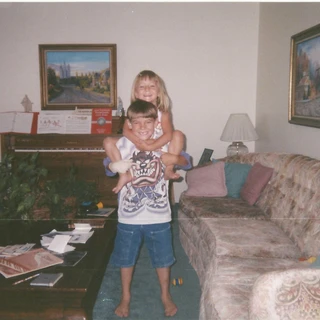 Alex giving Nicole a piggyback ride