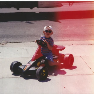 Alex driving a racecar