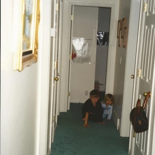 Alex and Nicole crawling in the hallway