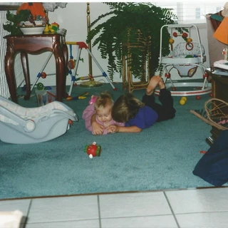 Alex and Nicole playing on the floor