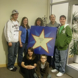 Family photo at Make A Wish Welcome sign (2)