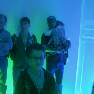 Alex standing by dad and Josh at Make A Wish