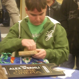 Alex opening a gift from Make A Wish