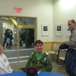 Alex sitting at the table with aunt Kristie