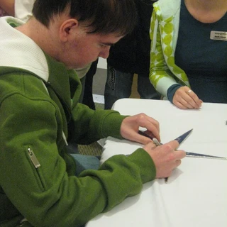 Alex signing his Make A Wish star