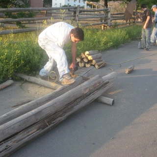 Connor cutting wood for Alex's eagle project