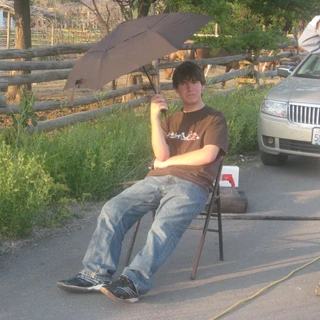 Alex sitting in a chair at his eagle project