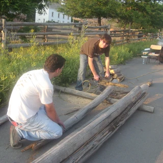 Connor and Alex cutting wood for Alex's eagle project