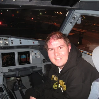 Alex in the cockpit of the plane