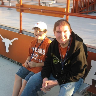 Alex and Josh sitting by the field