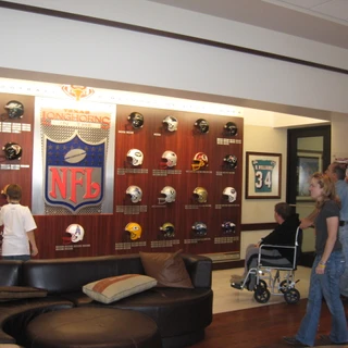 Alex, Josh, and Dad at NFL wall in Longhorns facility