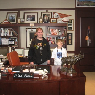 Alex and Josh at Mack Brown's desk