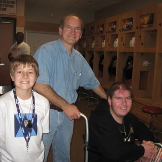 Alex, Dad, and Josh in the locker room