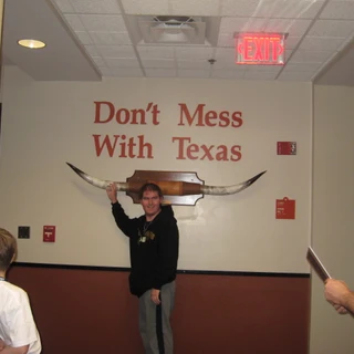 Alex touching a longhorn