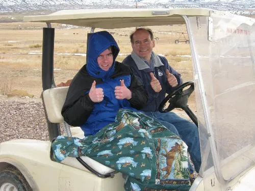Alex and Dad on a golf cart