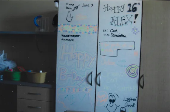 Alex's hospital board with birthday wishes from the staff