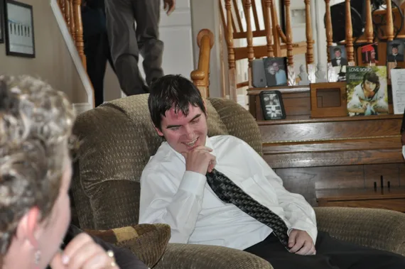 Alex smiling on the couch