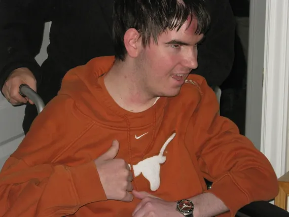 Alex giving a thumbs up in his Texas room