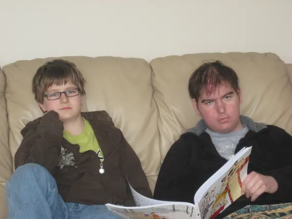 Alex and Josh reading Calvin and Hobbes