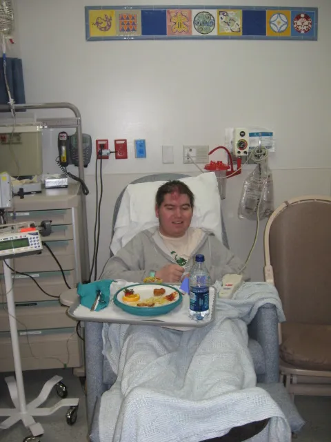Alex eating in his hospital bed