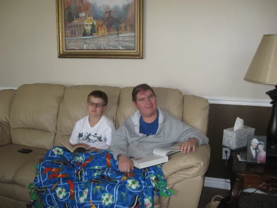 Alex sitting on the couch with Josh