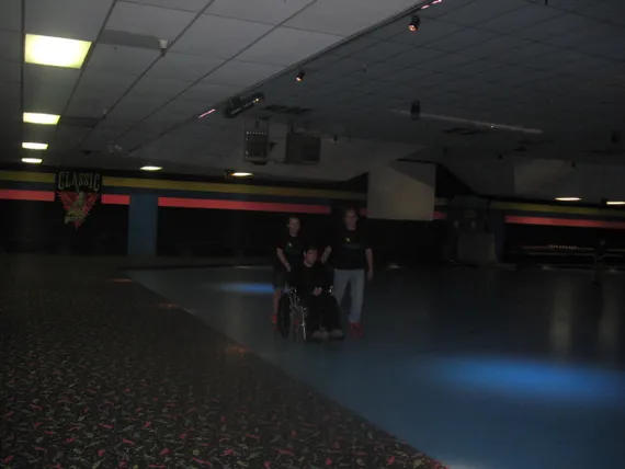 Alex at rollerblading with Nicole and Dad