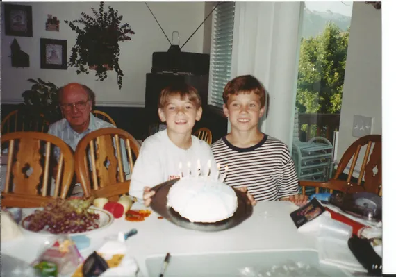 Alex and Chris with a birthday cake