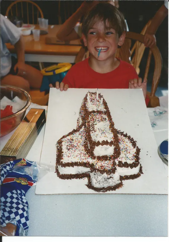 Alex with a rocketship birthday cake (2)