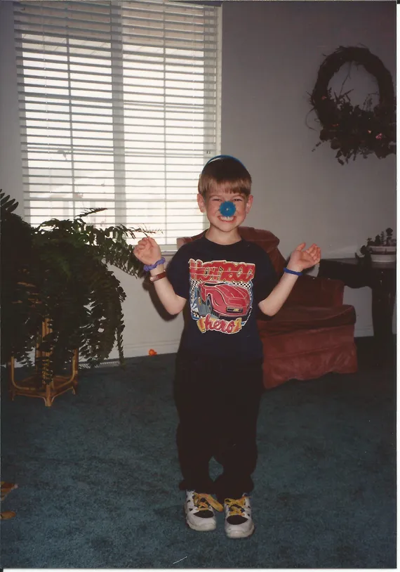 Alex wearing a blue nose