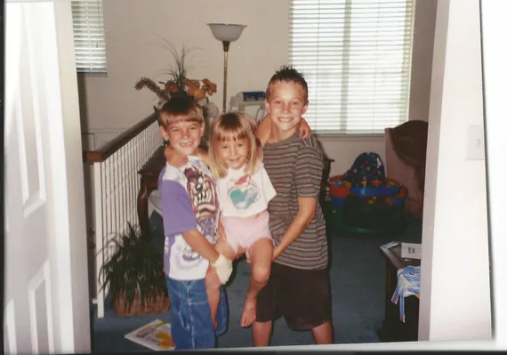 Alex and Chris holding Nicole