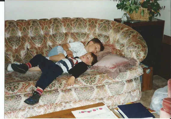 Alex and Chris sleeping on the couch