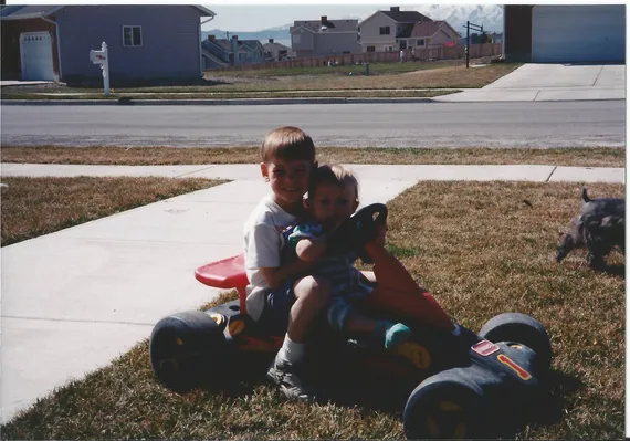 Alex and Nicole driving a racecar