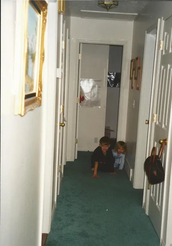 Alex and Nicole crawling in the hallway