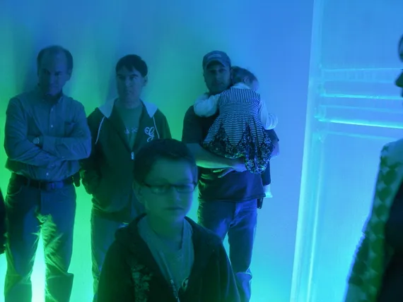 Alex standing by dad and Josh at Make A Wish