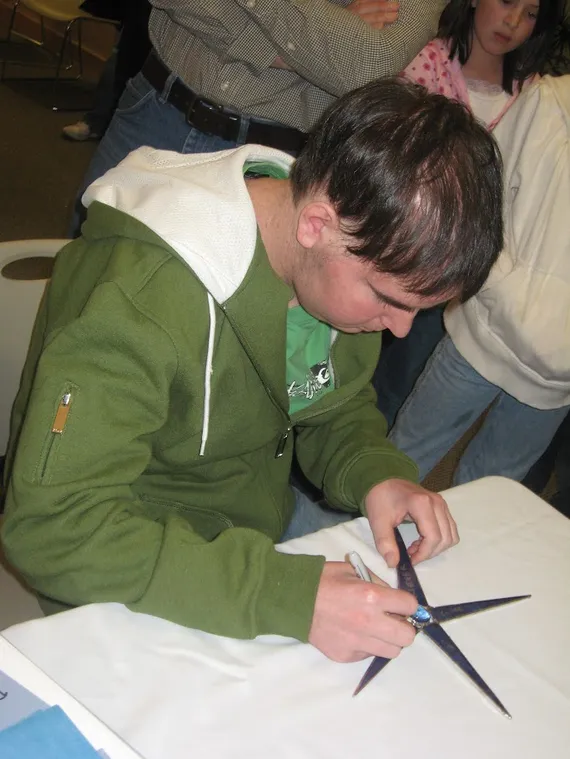 Alex signing his Make A Wish star (2)