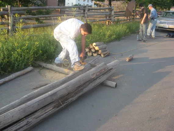 Connor cutting wood for Alex's eagle project